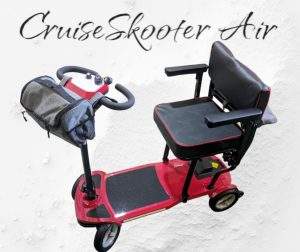 CruiseSkooter mobility scooter for cruises. Red with title and sand
